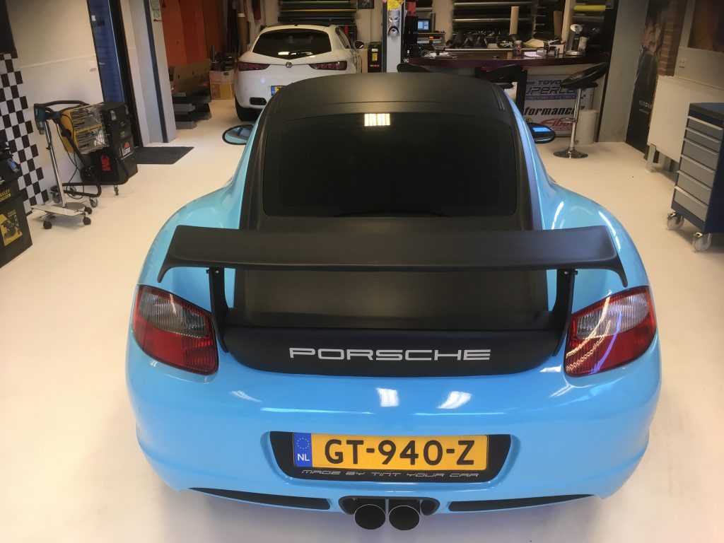 Porsche Cayman blauw gulf